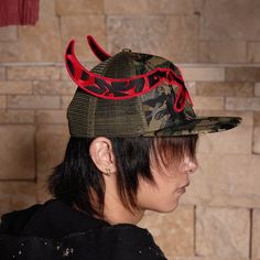 The Sickle Distressed Camo Baseball Cap expertly fuses street style with military-inspired elements, creating a bold and edgy accessory. The front of the cap features a stitched sickle, symbolizing strength and rebellion, while the left side is adorned with the Chinese characters "Knock down," adding a striking cultural touch. The cap is fully covered in a camouflage print, offering a rugged, tactical aesthetic. The back of the cap features a breathable mesh design, ensuring comfort during wear. Edgy Accessories, Sneakers And Socks, Half Shirts, Jean Accessories, Mesh Design, Military Inspired, Short Pants, Baseball Cap, Camouflage