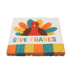 a napkin that says give thanks with a turkey on it