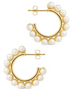 Make a statement with these stylish pearl bubble hoops! These earrings are perfect for any occasion, with a classic pearl-look and unique bubble design. Make a statement and show off your style - with these fun and fab bubble hoops on your ears! Materials: 14K gold plated brass, cubic zirconia, shell pearls Features: 1" hoop, 0.25" width, 4mm pearls, Lead & Nickel free, post back Trendy Hoop Pearl Earrings, Trendy Pearl Hoop Earrings, Chic Pearl Hoop Earrings For Party, Chic Small Hoop Earrings With Pearl Drop, Chic Pearl Hoop Earrings, Brass Shell, Bubble Design, Pearl Chain Necklace, Figaro Chain Necklace