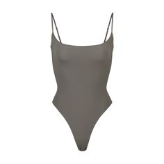 With its wide scoop neckline and low back providing the perfect foundation under clothing, this Cami Bodysuit is an essential wardrobe foundation. Features a high cut leg opening and thong back that remains invisible under clothing. High Cut Summer Leotard With Built-in Bra, Scoop Neck Swimwear With Built-in Bra, High Cut Seamless Summer Leotard, Chic Swimwear With Built-in Bra And Scoop Neck, Seamless High Cut Bodysuit For Beach, Elegant Swimwear With Scoop Back And Lined Body, Solid Seamless Backless Leotard, Seamless High-cut Bodysuit For Beach, Elegant Scoop Back Lined Swimwear