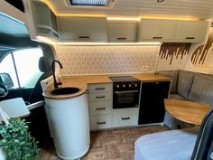 the interior of an rv is clean and ready to be used as a kitchen area