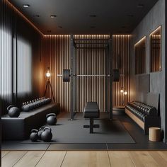 an empty gym room with black leather benches and kettles in front of a wooden wall