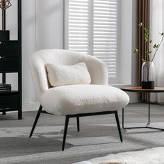 a white chair sitting on top of a carpeted floor