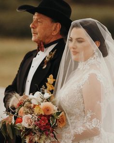 the bride and groom are looking at each other as they wait for their turn to walk down the aisle