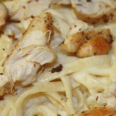 closeup of chicken and pasta with sauce on it's side, ready to be eaten