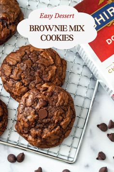 easy dessert brownie mix cookies on a cooling rack with chocolate chips and milk in the background