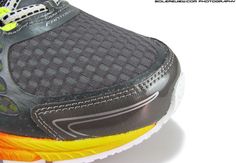 a close up view of the soles of a running shoe