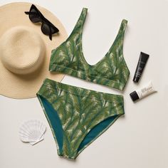 Perfect for the beach or laying by the pool, this olive green tropical high waisted bikini swimwear set features a painted brush stroke palm leaf pattern accented with a dark teal inner liner.  Designed in Cincinnati, Ohio, USA. Original artwork illustrated by Periwink Boutique. Made with a wink and a smile ;) This bikini is destined to become the only swimsuit you want to reach for in your drawer! The bottoms are high-waisted, and the top has removable pads. Both come with a tear-away care labe Green High Waist Swimwear For Sunbathing, Green High-waist Swimwear For Sunbathing, Green High Waist Tankini For Beach Season, Green High-waist Tankini For Swimming, Green High Waist Tankini For Summer, Summer High Waist Green Tankini, Green High Waist Summer Tankini, Green High-waist Summer Tankini, Tropical High Waist Swimwear For Pool