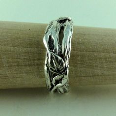 One-of-a-Kind Men's Sterling Silver Leaf & Twig Wedding Band NOTE: Each ring is Made-to-Order in the size needed. Material: Sterling Silver 92.5 Finish Shown: Light Oxidized (shown) it just brings out the depth and detail in the ring. Width: 8mm wide (widest Point) Hand sculpted twig band with 3 leaves, Continuous 360 design. This is a growing line for me, I love going into my studio and just start sculpting, something about the texture and leaves makes designing these pieces is so calming t Nature-inspired Engraved Wedding Rings, Spiritual Hand Cast Rings For Anniversary, Nature-inspired Polished Jewelry For Anniversary, Nature-inspired Ring For Wedding And Anniversary, Handmade Silver Jewelry For Marriage, Nature-inspired Silver Rings For Anniversary, Nature-inspired Silver Anniversary Rings, Handmade Silver Bands For Wedding, Unique Wedding Jewelry With Lost Wax Casting