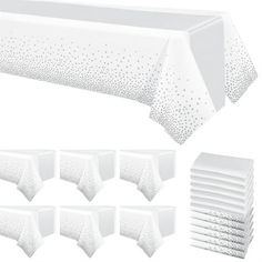 white tablecloths and napkins with dots on the top, set against a white background