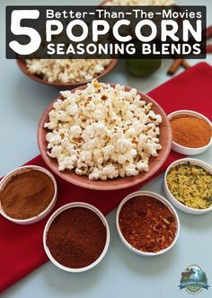 five bowls filled with different types of popcorn and seasonings on top of a table