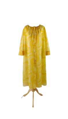 "Finnish vintage Mary-Ann 1960s lemon yellow house dress. Lovely oversized style with abstract print, wide sleeves, fabric covered buttons, and wide knee length hem. Fully lined, in very good vintage condition. Hem has been taken up. Material is good quality semi-sheer nylon (nylon lining). According to the tag, size 42. Fits EUR 40/42/44, UK 12/14/16, US 8/10/12 (see measurements below). Measurements (laid flat on one side): -underarm to underarm: 55 cm, 21.5\" -hips: 66 cm, 26\" -length: 110 c Yellow House, Yellow Houses, Mary Ann, Oversized Style, Fabric Covered Button, House Dress, Lemon Yellow, Wide Sleeves, Fabric Covered