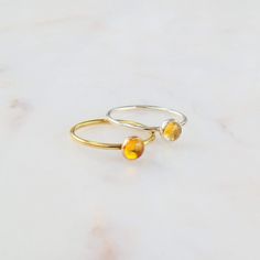 Radiate warmth and positivity with our stunning citrine ring. Crafted to capture the golden hues of the sun, this ring showcases the vibrant beauty of citrine gemstones. Perfect for adding a touch of brightness to your ensemble, or as a symbol of joy and abundance in your life. Don't know your ring size? Ring Size Guide or Buy Ring Sizer …………………………………. Details: Stone Citrine measuring 5mm Available in 14k Gold Filled or Sterling Silver Waterproof and can be worn everyday Size Inclusive and made Gold Gemstone Ring, Citrine Ring, Argentium Silver, Citrine Gemstone, Ring Size Guide, Birthstone Ring, Sterling Ring, Citrine, Gold Filled