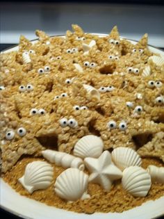 there is a cake with shells and eyes on it