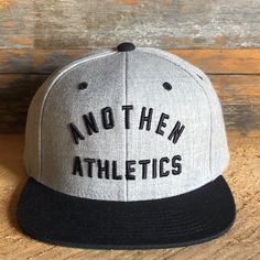 Our unisex high crown, 6-panel flat bill cap in Dark Grey w/green under visor is embroidered with our Anothen Athletics logo in the front and ANOTHEN logo in the back. One size, adjustable snap closure. Athletics Logo, 6 Panel Cap, Dark Grey, Trucker Hat, Light Grey, ? Logo, Black