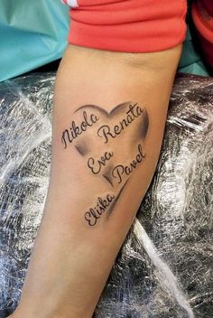 a woman's arm with a heart tattoo that says middle renta, love and always peace