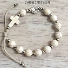 Adjustable Miraculous Medal For Gift, Adjustable Silver Cross Rosary Bracelet, Adjustable Crucifix Spiritual Bracelet, White Cross Jewelry With Miraculous Medal, White Cross Bracelet Spiritual Style, White Adjustable Hypoallergenic Rosary Bracelet, Adjustable Cross Rosary Bracelet For First Communion, White Miraculous Medal Spiritual Jewelry, Adjustable White Rosary Bracelet Gift