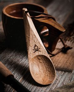 two wooden spoons sitting on top of a table