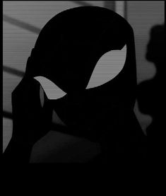 the silhouette of a person with an alien face