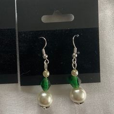 This unique pair of earrings is the perfect gift for any occasion. The vibrant green colors combined with the leaf-shaped bead cap give this pair a nature-y feel that you are sure to love. There is only one in stock, so buy soon! All findings are nickel-free, beads were thrifted, and materials were purchased at respectable stores. Pearl beads are faux. Thank you for shopping with us! If you like what we make, follow us over on Instagram @halcyon_delights Green Dangle Flower Earrings For Party, Nickel-free Green Earrings For Party, Green Dangle Flower Earrings For Gift, Green Teardrop Clip-on Earrings, Elegant Green Nickel-free Clip-on Earrings, Green Nickel-free Party Earrings, Green Beaded Teardrop Jewelry, Green Dangle Earrings For Pierced Ears, Green Drop Crystal Earrings