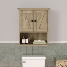 a wooden cabinet above a toilet in a bathroom