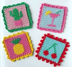 four crocheted coasters with different designs on them