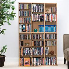 a bookshelf filled with lots of different types of dvd's and movies