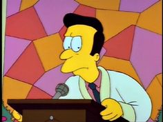 the simpsons is speaking into a microphone