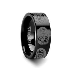 a black ring with an image of lions on it