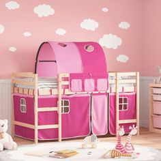 a child's bedroom with pink furniture and clouds painted on the wall