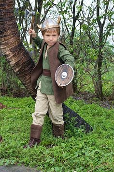 a young boy dressed up as a knight