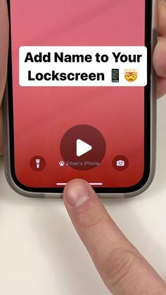 someone is holding their cell phone with the text add name to your lock screen on it