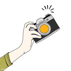 a hand holding a camera with an orange lens