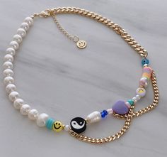 "ITEM DETAILS: * Material: 18k Gold Filled Chain Freshwater Pearl Multicolored Beads Gold Heart Beads Face Round Beads Nickel Free Hypoallergenic * Size Chain: 15\" + 2\" Extension Each Necklace is Handmade 💕 There are slight variations in the colors. If you have any suggestions, just let me know in a message and I will try to do my best according to availability at the time of order. * Shipment: Everything Is made to order. Order preparation may tak 3 To 5 business day. * Packaging: The jewels Yin Yang Necklace, Necklace Y2k, Horoscope Necklace, Y2k Necklace, Beaded Necklace Diy, Gold Filled Necklace, Chunky Beads, Necklace Pearl, Beaded Accessories