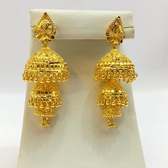 "Handmade Jhumka Earrings 22ct Micro Gold Plated Earrings Indian jewelry Pakistan Jewelry  Length:2.8\"Inches Approx  Traditional Indian Wedding Jewellery Slight Colour variations possible due to difference in screen and photograph  It is a perfect match with formal attire on special occasions or with casual wearing Care instructions Keep Jewellery away from direct heat, water, perfumes, deodorants and other strong chemicals as they may react with the metal or plating. The plating composition of Jewellery is as such that  perspiration (sweat) will not damage it. Wipe Jewellery gently with chamois cloth or leather swatch after every use. Wiping the jewellery with a soft cloth after removing the jewellery would add to its life. Avoid water  exposure for all jewelry  Thank You For Visiting" Gold Jhumkas For Puja And Eid, 22k Gold Bollywood Earrings For Puja, Heavy 22k Gold Earrings For Puja, Bollywood Yellow Gold Earrings For Puja, Gold Bollywood Jhumkas For Puja, Bollywood Style Yellow Gold Earrings For Puja, Bollywood Style Yellow Gold Jhumkas For Puja, Heavy 22k Gold Danglers For Festivals, Gold Dangle Jhumkas For Eid