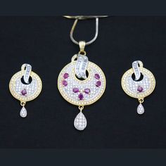 Indian Designer Red Ruby CZ White Pendant Earrings Women Fashion Traditional Party Wear Wedding Jewelry This is a set of beautiful Pendant Earrings studded with high-quality CZ Stones. (Indian Pendant, Bollywood Pendant, Asian Pendant, Traditional Pendant, Ethnic Pendant, Designer Pendant, Fashion Pendant, Wedding Pendant, Bridal Pendant) ITEM DESCRIPTION Metal = Gold Plated Occasion = Wedding ,Party Wear, Bridal Color = White and Red Size = Pendant Size - 2 Inches, Earrings Size - 1 Inches, Cha Party Jewelry Sets With American Diamond And Round Shape, White Ruby Jewelry Sets For Gift, Ruby Jewelry Sets For Celebration, Red Round Jewelry Sets With Matching Earrings, Red Round Jewelry Sets With Elegant Design, Red Cubic Zirconia Jewelry Sets For Festive Occasions, Red Cubic Zirconia Jewelry Sets For Celebration, Red Hand Set Earrings For Party, Hand Set Red Earrings For Party