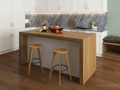 two stools sit at the center of a kitchen island