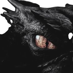 the face of a black dragon with red eyes