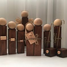 a group of wooden dolls sitting next to each other