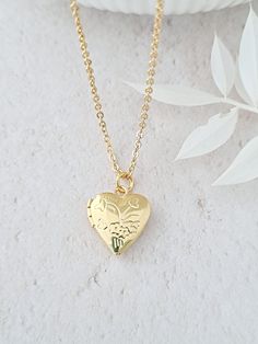 Tiny gold heart locket necklace. Photos can be added either side by slipping them under the rim of the locket. Simple and minimalist. The locket is 12mm in diameter. Silver plated locket is also available in this shop - see picture. I do not fit photos as I do not have the facilities to do do. Necklaces, bracelets and anklets where possible will arrive on a necklace card and placed inside an organza bag ready for giving - see last picture. This item ships from the UK within 1 working day. Gold Heart Locket Necklace, Fit Photos, Gold Heart Locket, Heart Locket Necklace, Photo Locket, Necklace Minimalist, Keepsake Jewelry, Heart Locket, Locket Necklace