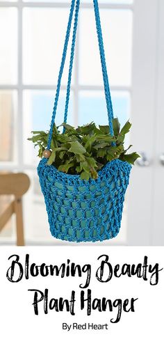 a blue hanging planter with green plants in it and the words, blooming beauty plant hanger