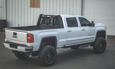 a white truck parked in front of a building