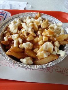 a bowl filled with food sitting on top of a tray