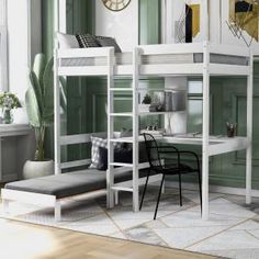 a bunk bed with a desk and chair underneath it in a room that has green walls