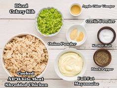 ingredients for chicken salad laid out in bowls on a white wooden table with text describing the ingredients