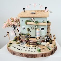 a cake made to look like a house with lots of decorations on top of it