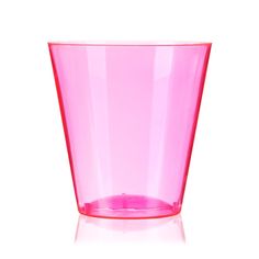 a pink cup sitting on top of a white table