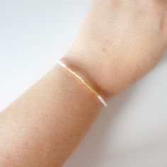 Dainty and delicate white and light gold beaded stacking bracelet, available in all sizes at checkout.❤ SIZESThis item comes in several sizes, kindly choose at checkout. The standard size for an average woman is 7”. For a child, perhaps a 6” would be appropriate. If you'd like a clasp extender because you are unsure of the right size, please add this to the cart: https://www.etsy.com/listing/187503833/clasp-extender❤ PROCESSING AND SHIPPINGMost orders are made and shipped out in one business day White And Gold Bracelet, Average Woman, Bracelet Stacking, Bracelet Minimalist, Dainty Bracelet, Minimalist Bracelet, Dainty Bracelets, Ankle Bracelet, Ankle Bracelets