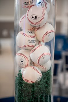 many baseballs are in a clear plastic container