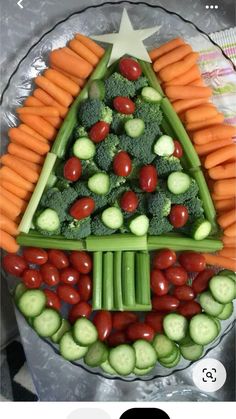 a christmas tree made out of veggies and carrots